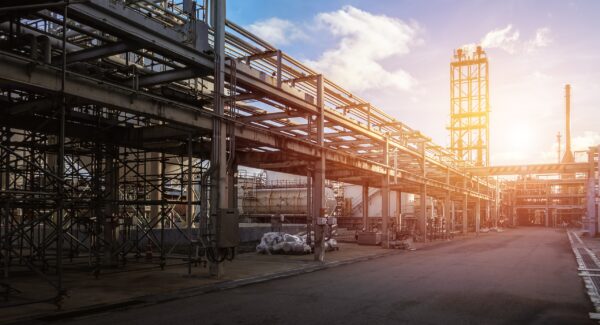 pipeline-pipe-rack-petroleum-industrial-plant-with-sunset-sky-background-scaled